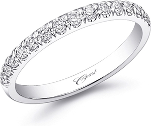 This precious and petite wedding band features fine pave set diamon...