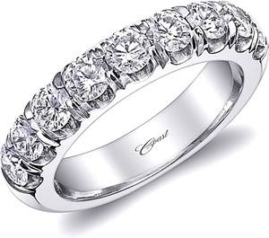 An exquisite band featuring a sumptuous row of diamonds across the ...