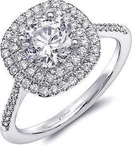 Petite diamonds grace the shoulders and halo of this sparkling enga...