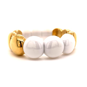 This bracelet features ceramic beads with an 18k yellow gold finish...
