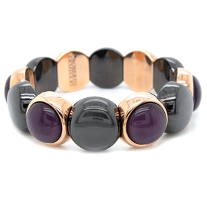 This bracelet features black ceramic beads and alternated crystal i...
