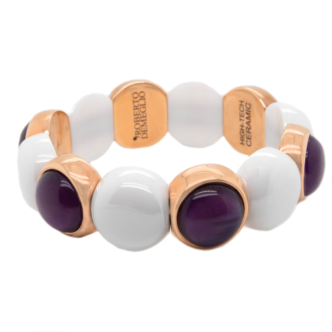 This bracelet features ceramic beads and alternated crystal on a st...