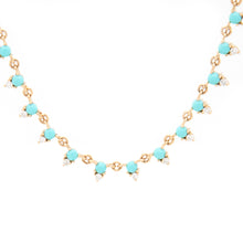 This colorful necklace features diamonds and turquoise totaling .28ct