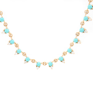 This colorful necklace features diamonds and turquoise totaling .28ct