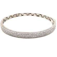 This classic style bangle features rows of round brilliant cut diam...