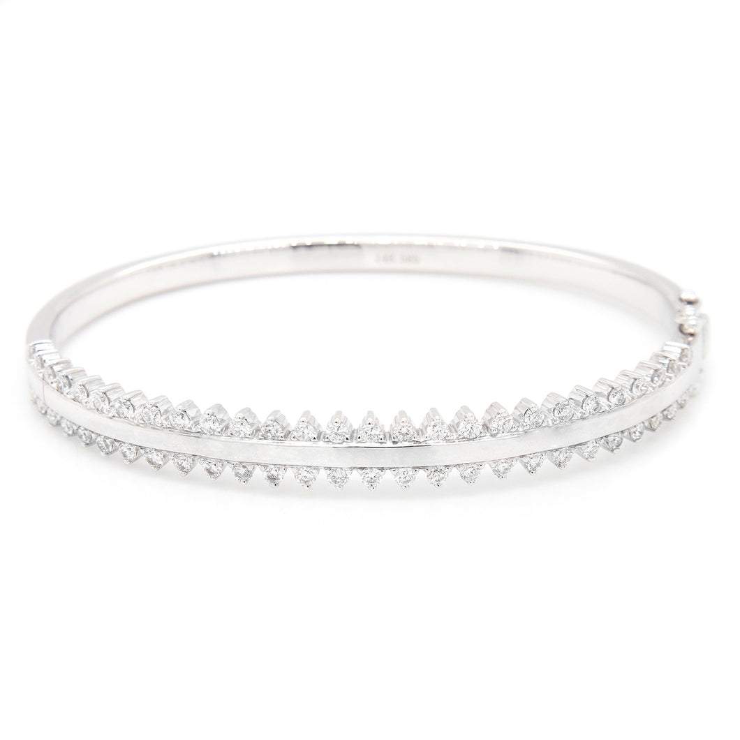 This bangle features two rows of 54 round brilliant cut diamonds to...
