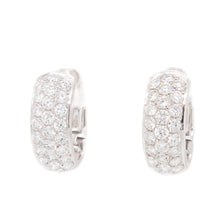 these huggy earrings feature 50 pave-set, round brilliant cut diamo...