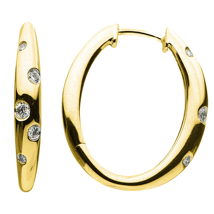 Oval shaped hoops with 13 round brilliant cut diamonds totaling .13ct