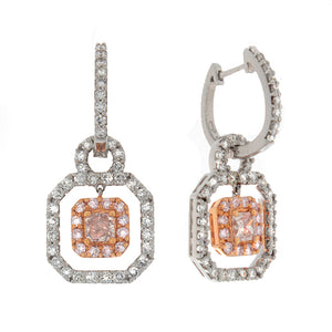 These stunning earrings feature white diamonds that total 1.10cts a...