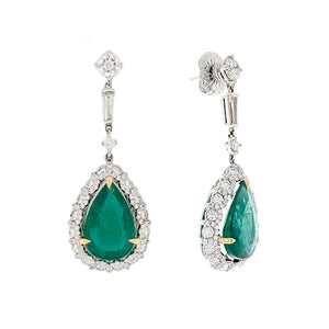 These earrings feature two green emerald pears that total 13.40cts ...