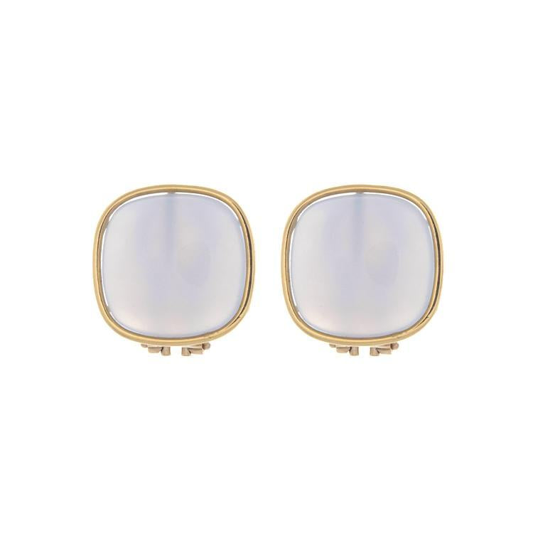 These stunning earrings feature a chalcedony stone set in a gold be...