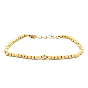 14k yellow gold bead chain bracelet with a bezel-set round brillian...