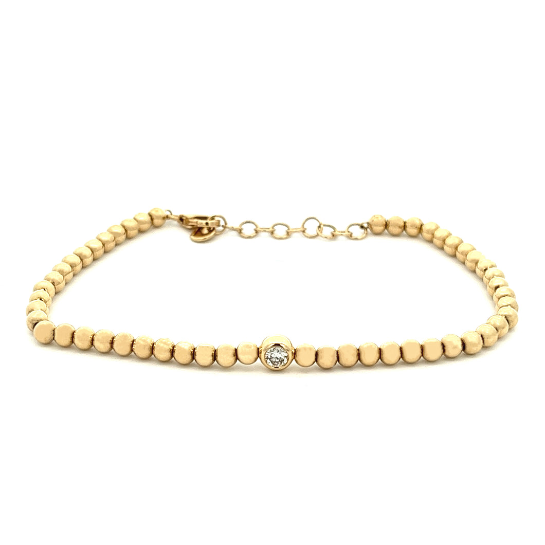 14k yellow gold bead chain bracelet with a bezel-set round brillian...