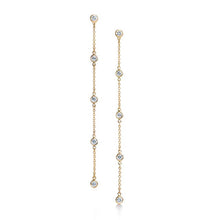 These earrings feature bezel set round brilliant cut diamonds that ...