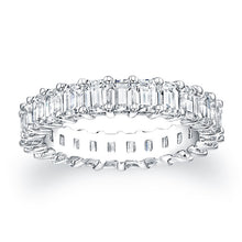
Emerald cut diamonds are set in a continuous circle using shared p...