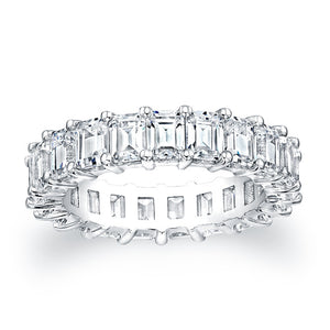 
Emerald cut diamonds are set in a continuous circle using shared p...