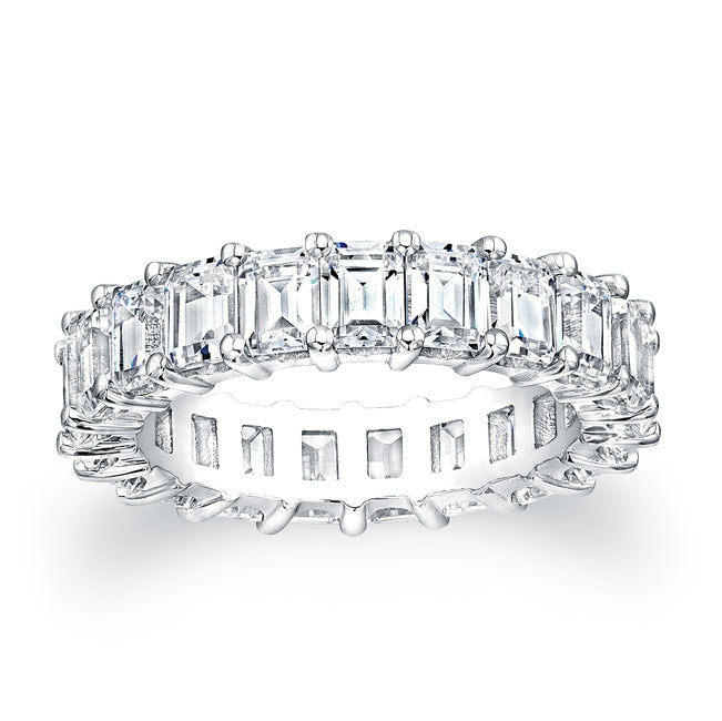 
Emerald cut diamonds are set in a continuous circle using shared p...