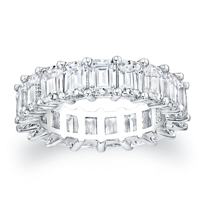 



Emerald cut diamonds are set in a continuous circle using share...
