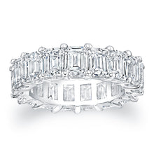 
Emerald cut diamonds are set in a continuous circle using shared p...