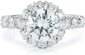 This diamond engagement ring setting features French pave set round...