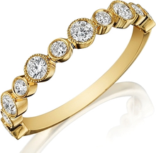 This Henri Daussi wedding band features bezel set round brilliant c...