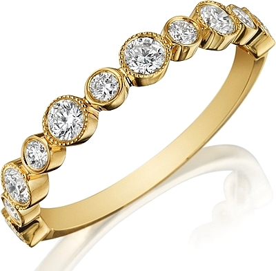 This Henri Daussi wedding band features bezel set round brilliant c...