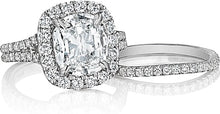 This Henri Daussi contoured band features pave set round brilliant ...