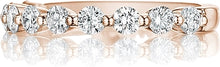 This classic style by Henri Daussi features a single row of round b...