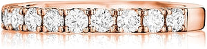 This stylish band by Henri Daussi features a single line of round b...