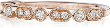 This Henri Daussi band features round brilliant bead and bezel set ...