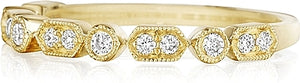 This Henri Daussi band features round brilliant bead and bezel set ...