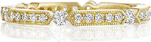 This Henri Daussi yellow gold band features round brilliant bead se...