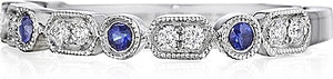 This Henri Daussi band features round brilliant bead and bezel set ...