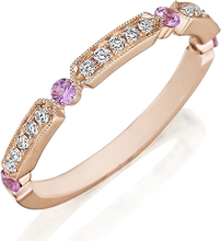 This Henri Daussi yellow gold band features round brilliant bead se...