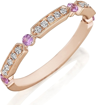 This Henri Daussi yellow gold band features round brilliant bead se...