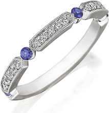 This Henri Daussi yellow gold band features round brilliant bead se...