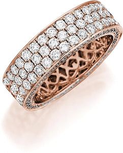 This Henri Daussi rose gold band features a triple row of round bri...
