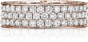 This Henri Daussi rose gold band features a triple row of round bri...