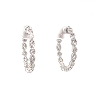 These vintage inspired hoop earrings feature diamonds totaling .20ct