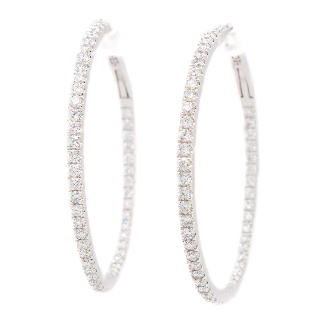 These hoops feature 104 pave-set, round brilliant cut diamonds tota...