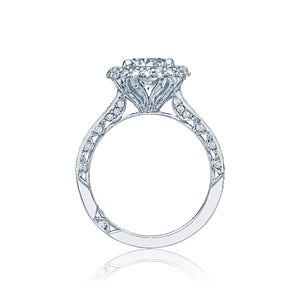 A round diamond of your choice shines in a double bloom of diamonds...