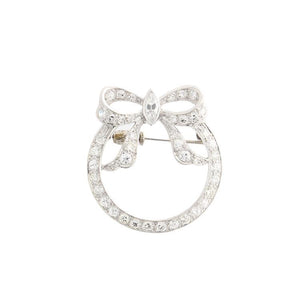 This platinum brooch features 1.81cts of round and marquise diamonds.