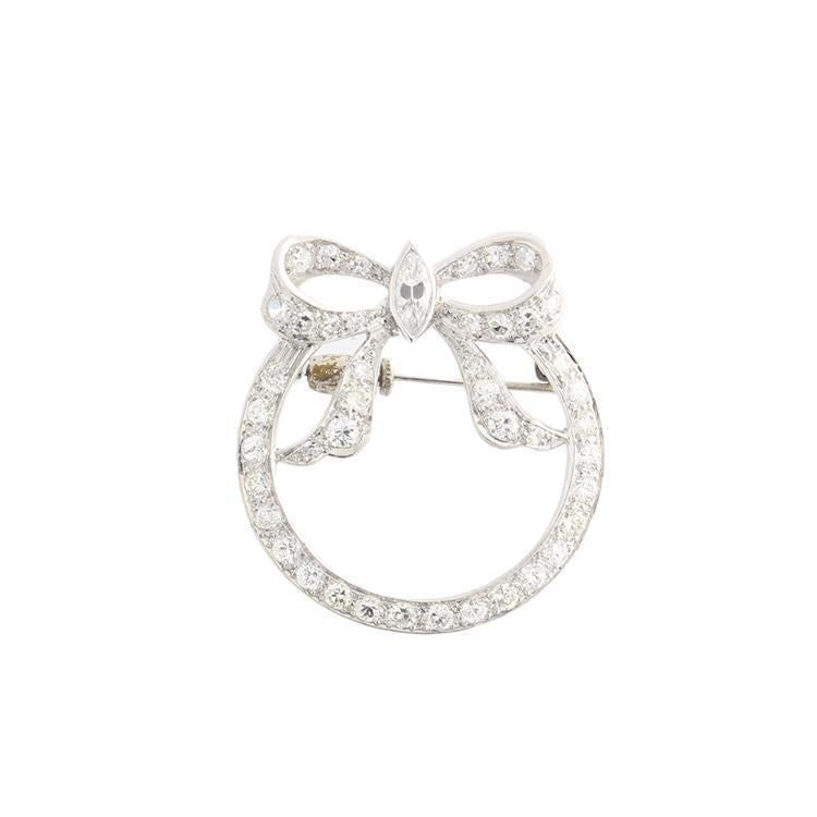 This platinum brooch features 1.81cts of round and marquise diamonds.