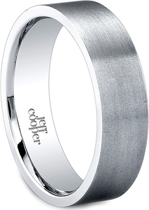 This simple wedding band by Jeff Cooper has a brush finish with a c...