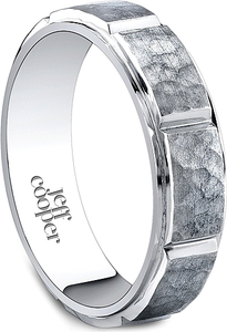 This wedding band by Jeff Cooper is a segmented band with a hammere...