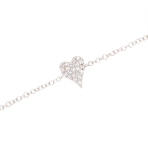 This minimalist bracelet features a mini heart charm that features ...