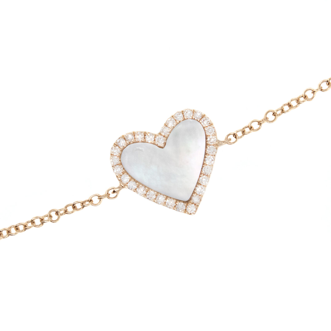this bracelet features a white mother of pearl heart inlay with sur...