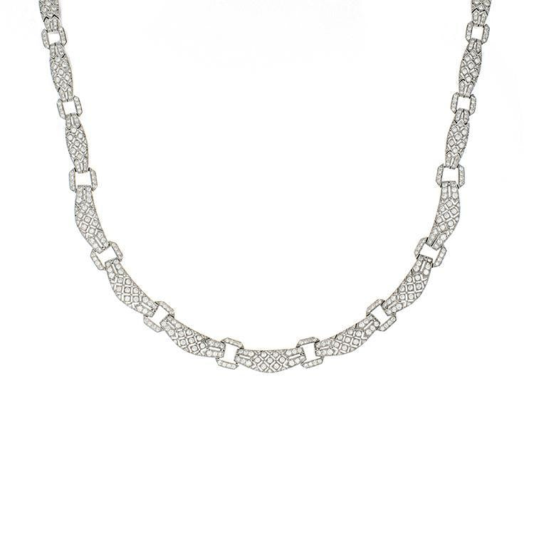 This necklace features 5.00cts of round diamonds in an intricate de...