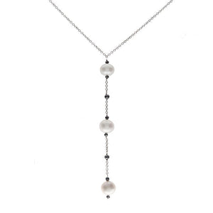 This necklace features 1.72cts of black diamonds with three pearl d...