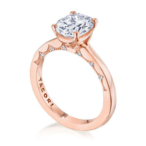 This solitaire diamond engagement ring features pave set round bril...